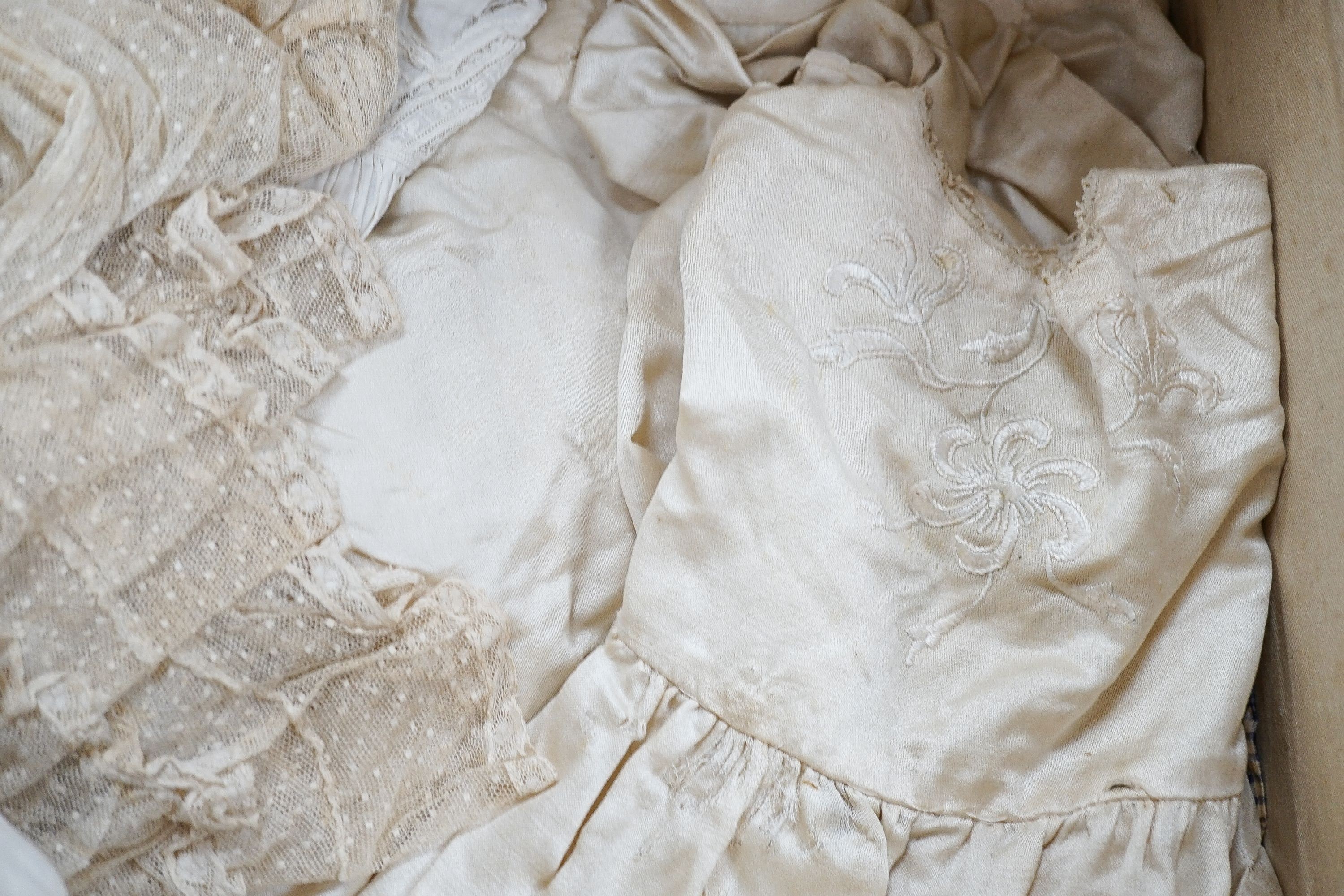 Various christening gowns, 2 dresses in a suitcase